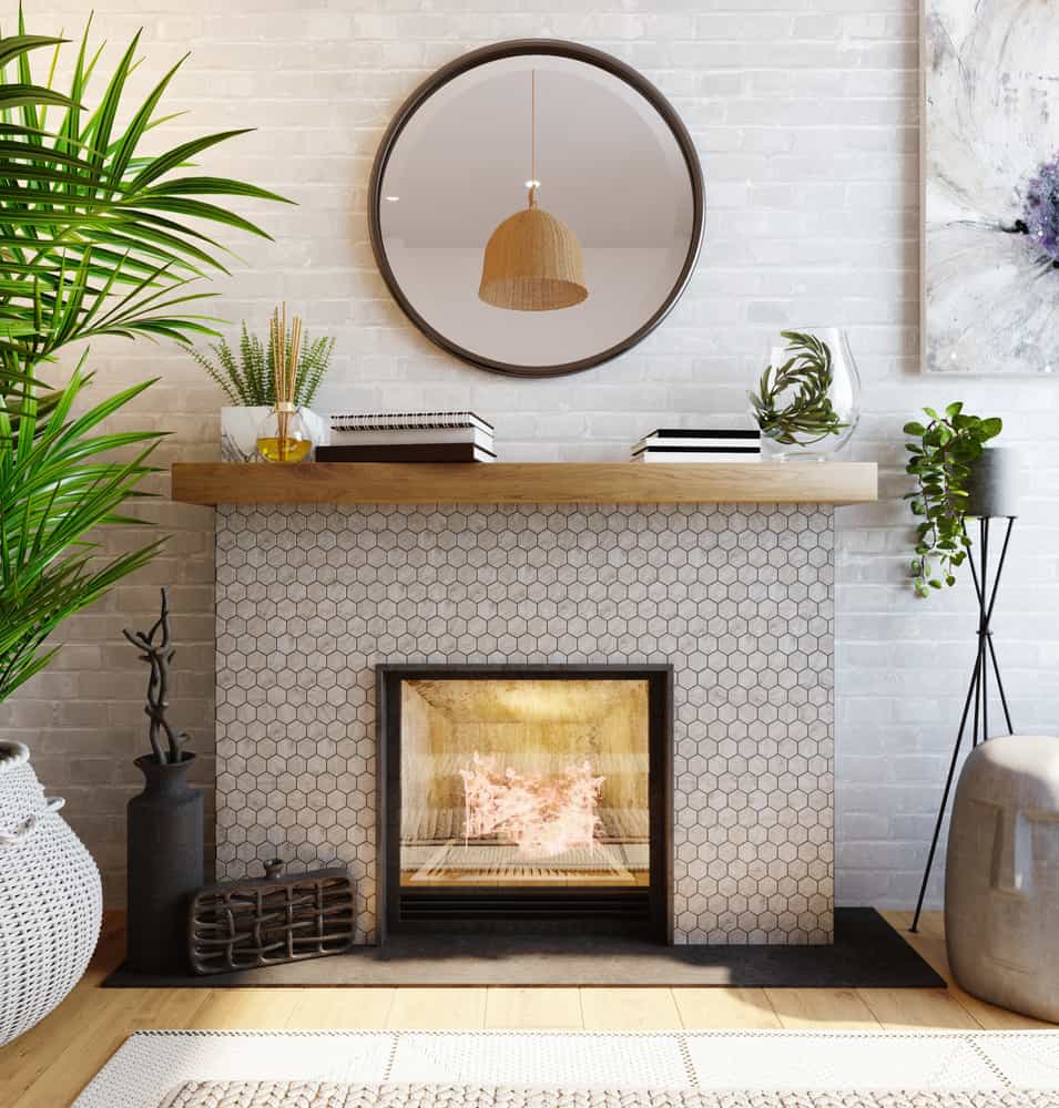 White brick fireplace with wooden mantle